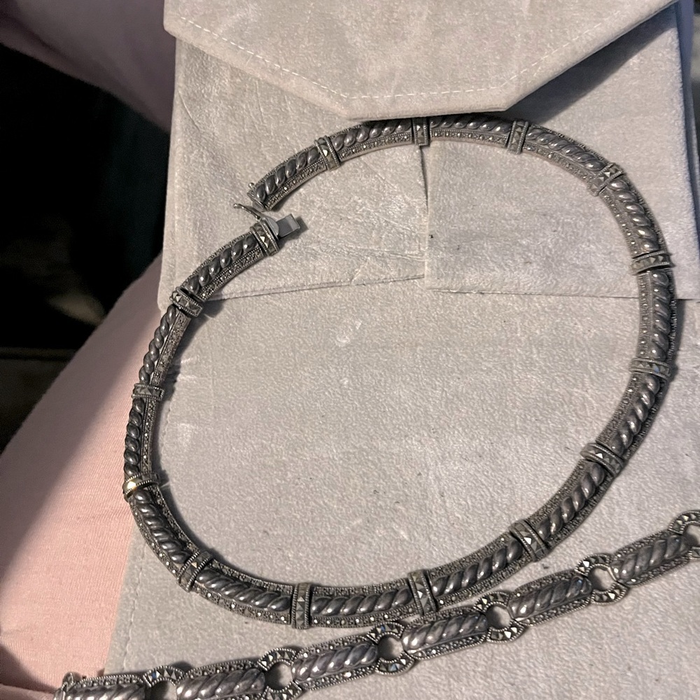 Matching sterling silver necklace and bracelet.